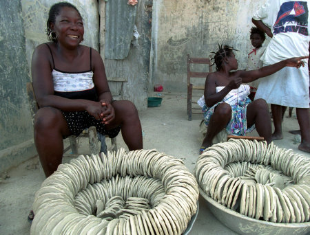 Bouillon flavored clay cakes for hungry Haitians, Port-au-Prince, Haiti