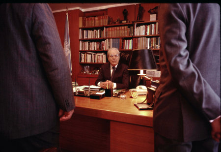 UN Secretary General Javier Perez de Cuellar receiving his daily security briefing.
