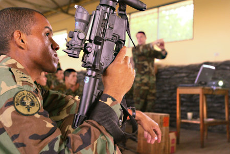 U.S. Special Forces training Colombian soldiers on the use of new firearms. Saravena, Colombia.