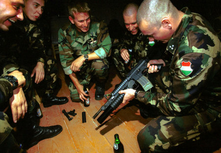 NATO war games in the Ukraine. US Marines share beers and guns with Hungarian Special Forces.